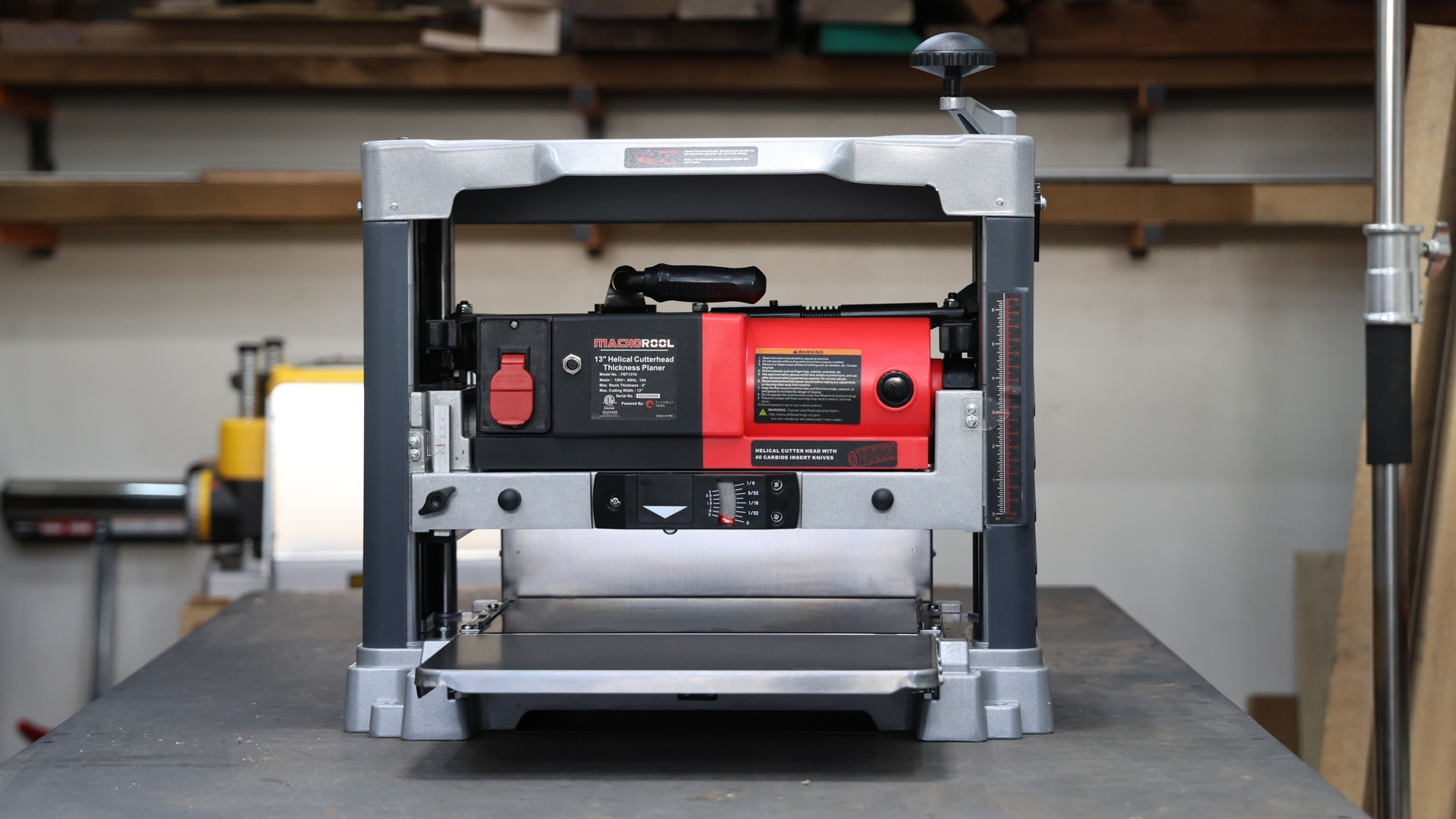 Front view of the FindBuyTool FB131H 13-inch helical head planer in a woodworking shop