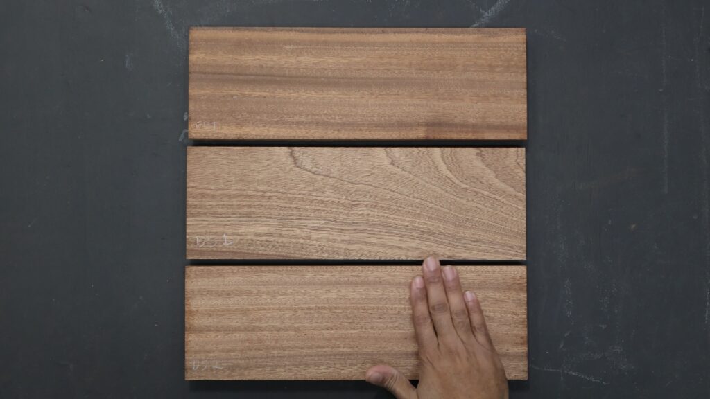 Three wood boards planed with different machines showing surface finish differences