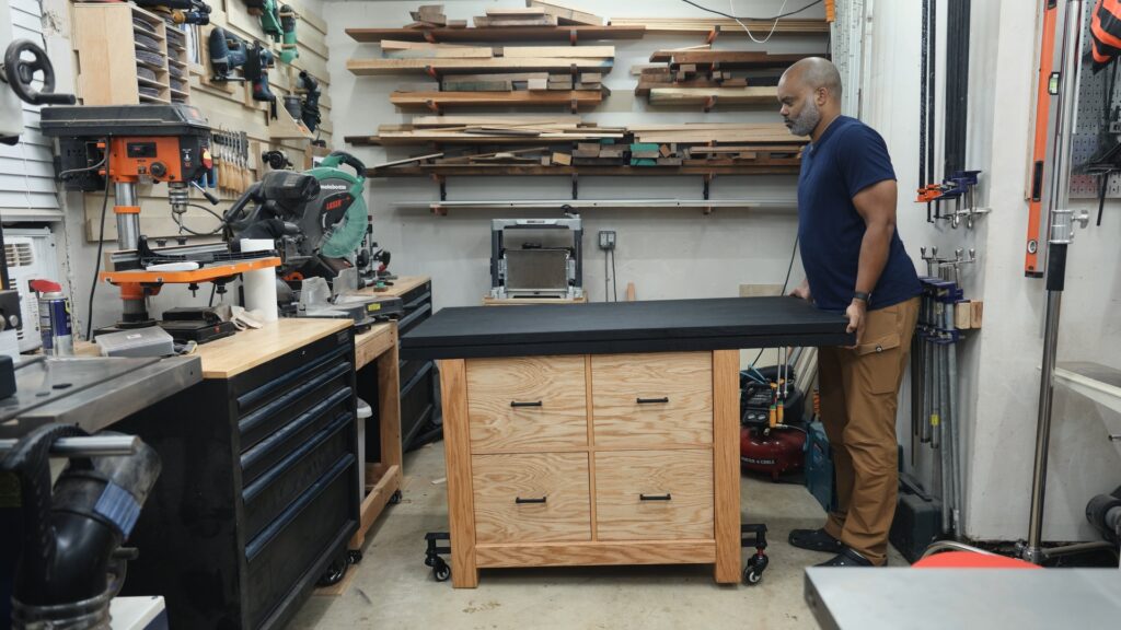 Wooden workbench raised on Bennington Smart Casters in a home workshop.