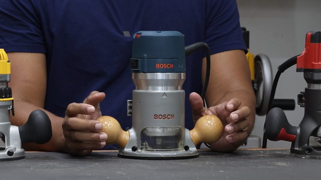 Bosch 1617EVSPK router fixed base with wooden handles for improved control.