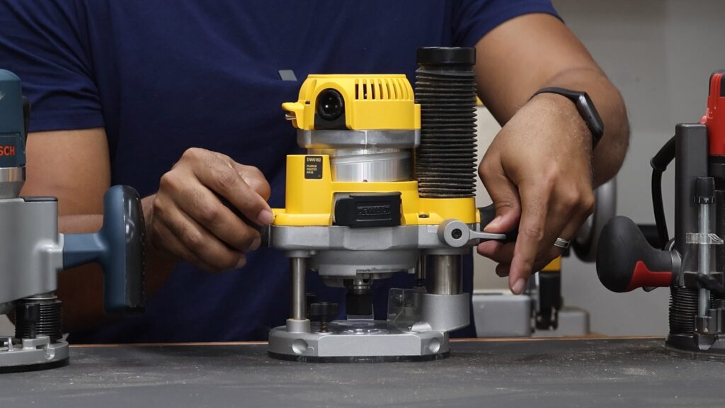 DeWalt DW618PKB router showing the plunge mechanism and smooth action.