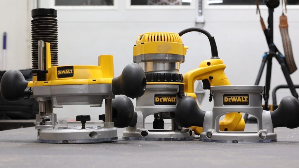 DeWalt DW618B3 router kit with plunge base, fixed base, and D-handle base.