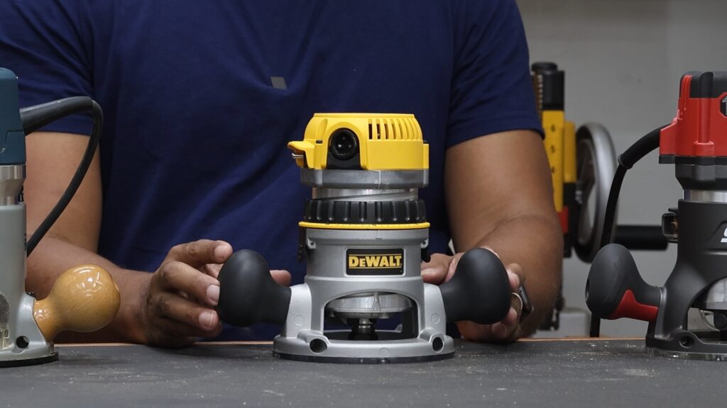 DeWalt DW618PKB router fixed base with large rubberized handles.