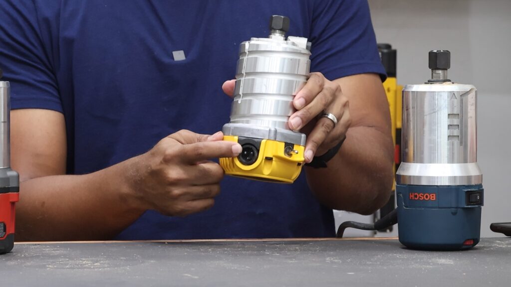 DeWalt DW618PKB router motor with detachable power cord removed.