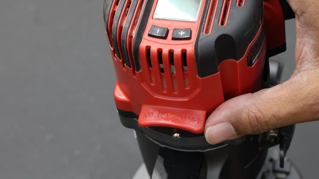 Close-up of the SKIL router showing the red on/off power switch.