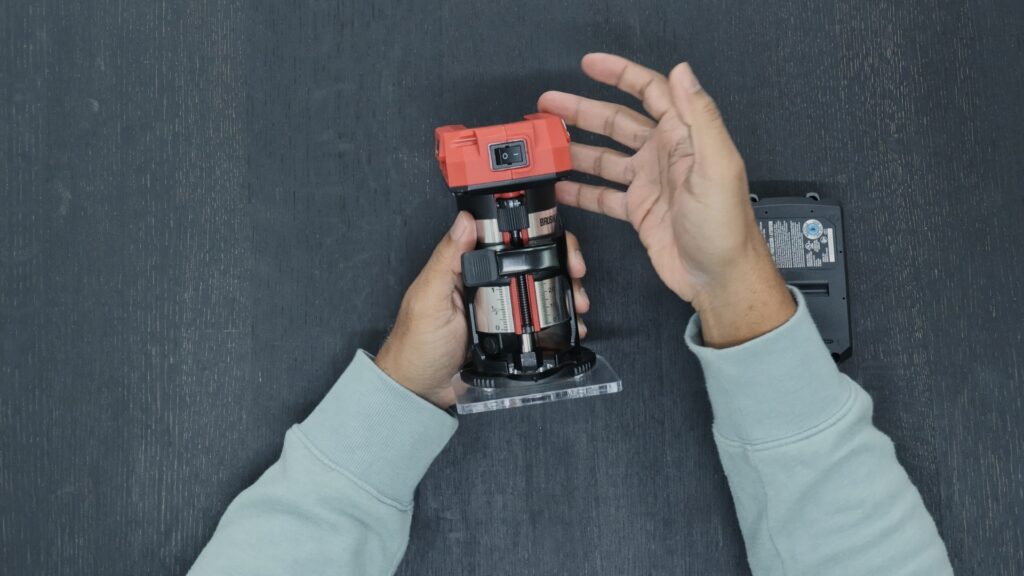 Demonstrating the lightweight design of the SKIL RT1430B cordless trim router