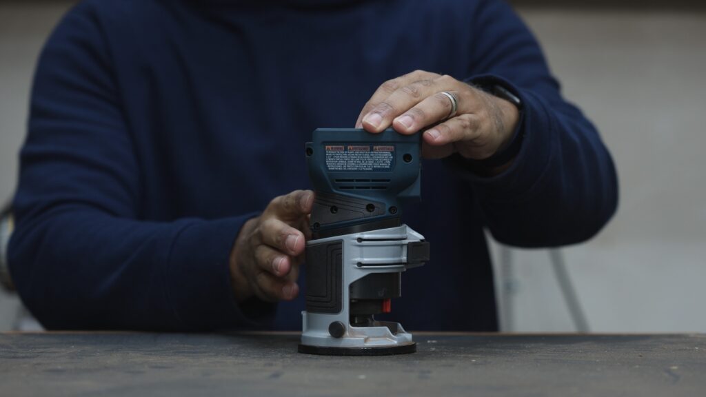Ergonomic grip design on the Bosch GKF18V-25 cordless trim router