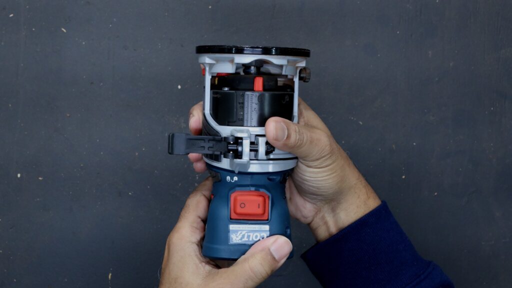 Lock and unlock adjustment positions on the Bosch GKF18V-25 trim router base