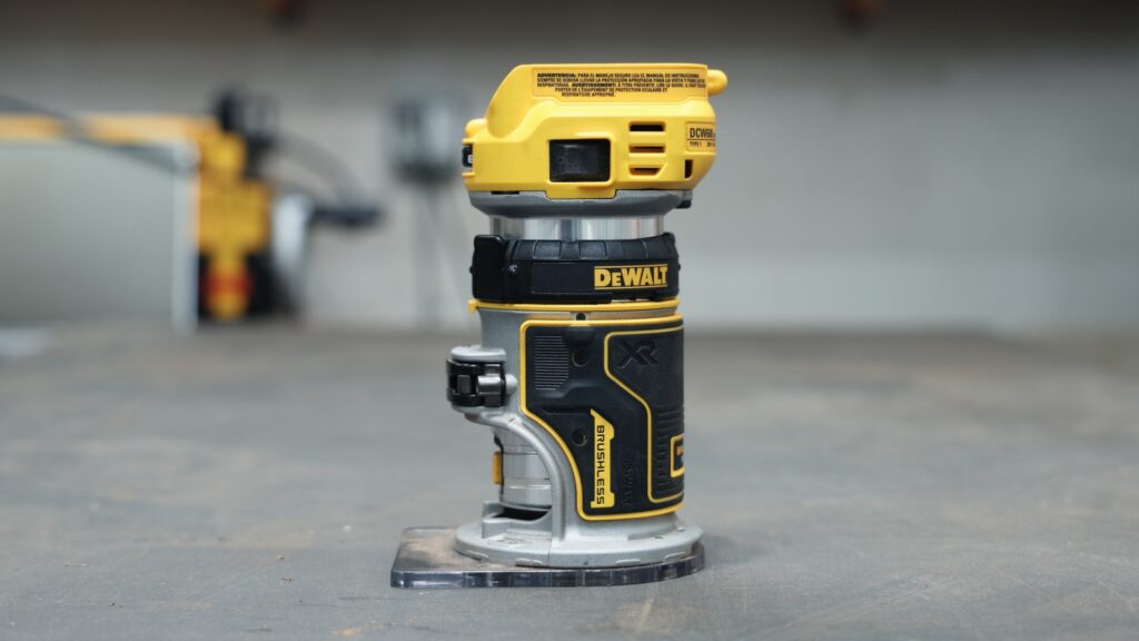 DeWalt DCW600B cordless trim router on workbench