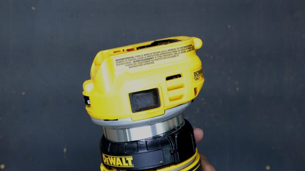 Power switch location on the DeWalt DCW600B cordless trim router