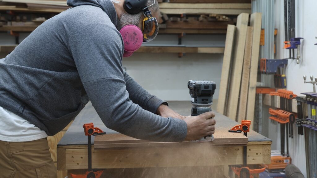 Flex FX4221 cordless trim router cutting a rabbet in hardwood