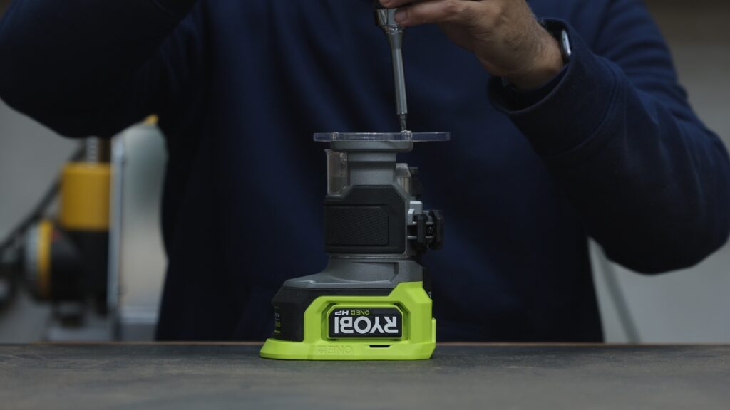 Flipping and reinstalling the base on the Ryobi ONE+ HP cordless trim router